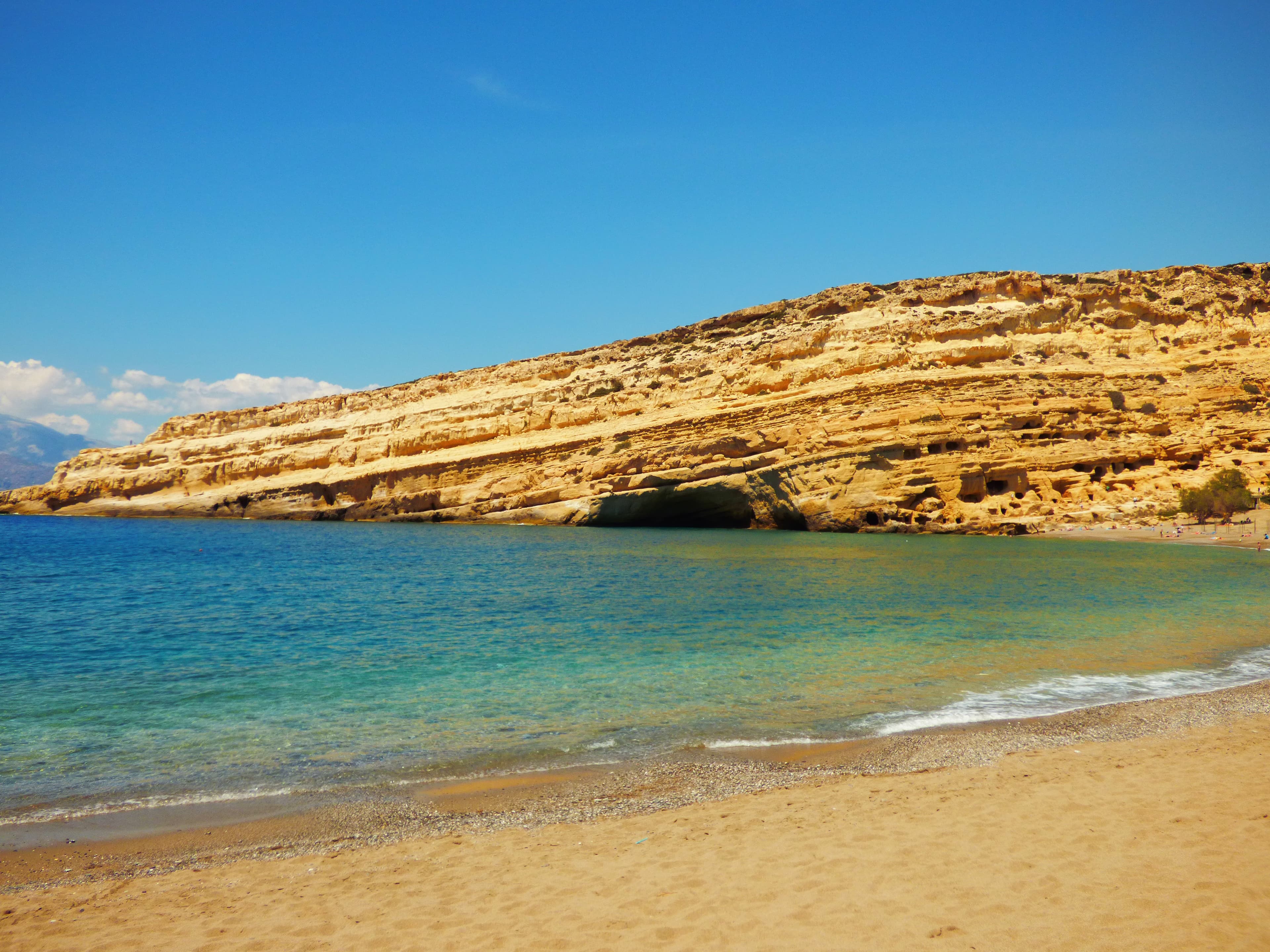 Matala Beach in southern Crete with its iconic sandstone cliffs